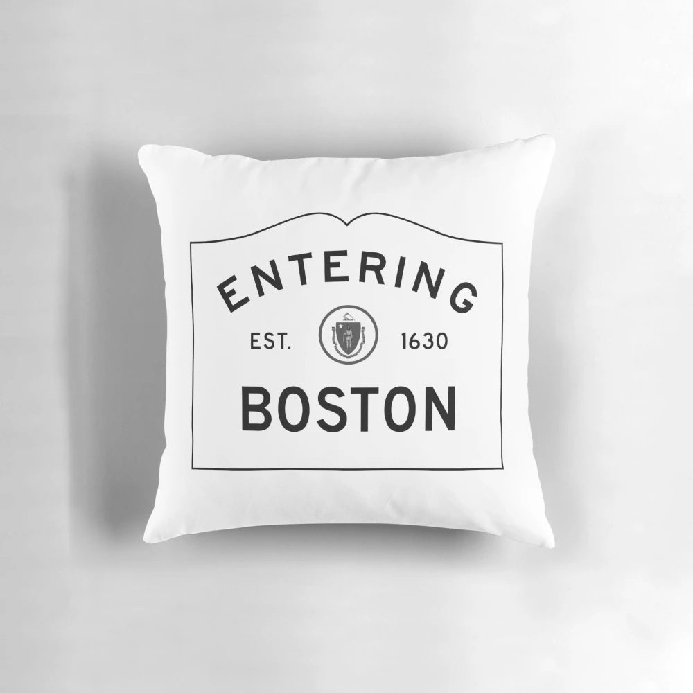 Entering Boston sign in front of a red and white brick building