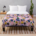 Iconic Gilmore Girls pattern printed on a soft and cozy pink plush blanket