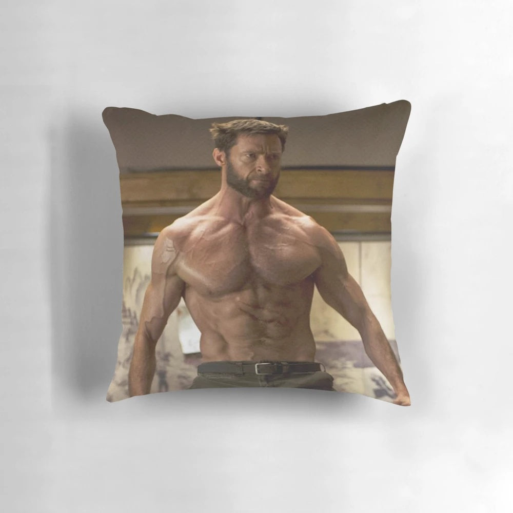 Image of a plush pillow featuring the face of actor Hugh Jackman, known for his roles in X-Men and other action movies.