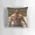 Image of a plush pillow featuring the face of actor Hugh Jackman, known for his roles in X-Men and other action movies.