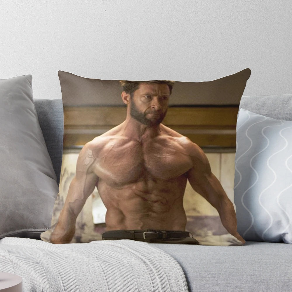 Image of a plush pillow featuring the face of actor Hugh Jackman, known for his roles in X-Men and other action movies.