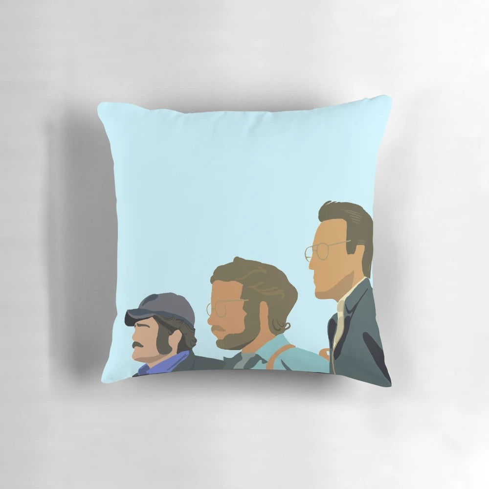 A minimalist blue and white pillow featuring the iconic silhouette of the shark from the classic film Jaws.