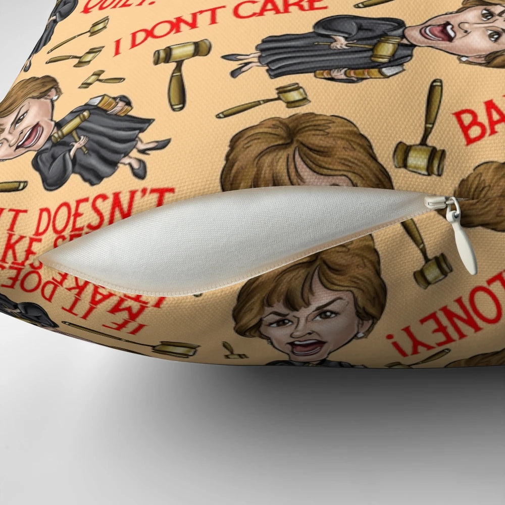 An orange throw pillow featuring a stylized image of TV personality Judge Judy, perfect for pop culture enthusiasts.