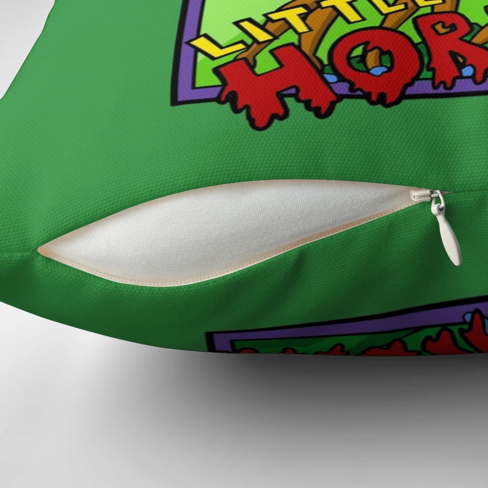 A plush throw pillow featuring the classic "Little Shop of Horrors" design, including Audrey II and the urchins.