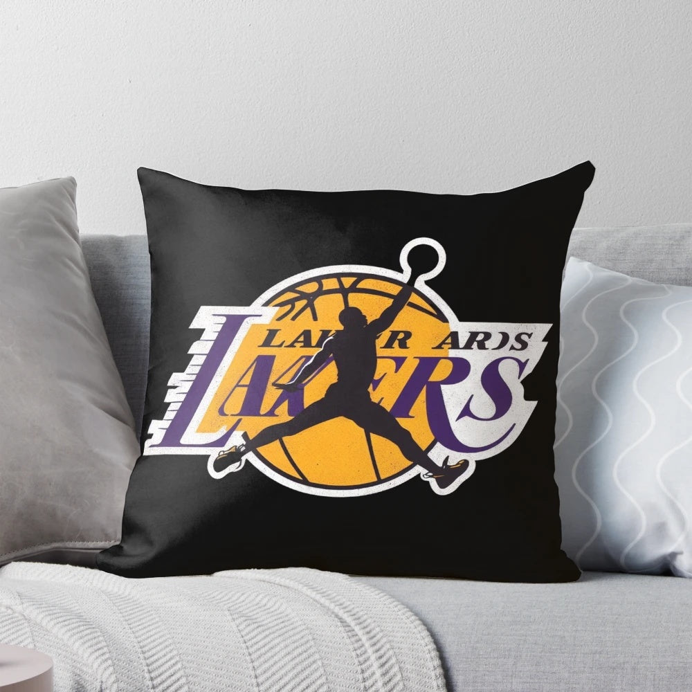 Los Angeles Lakers basketball pillow featuring the team logo and iconic players like LeBron James and Kobe Bryant