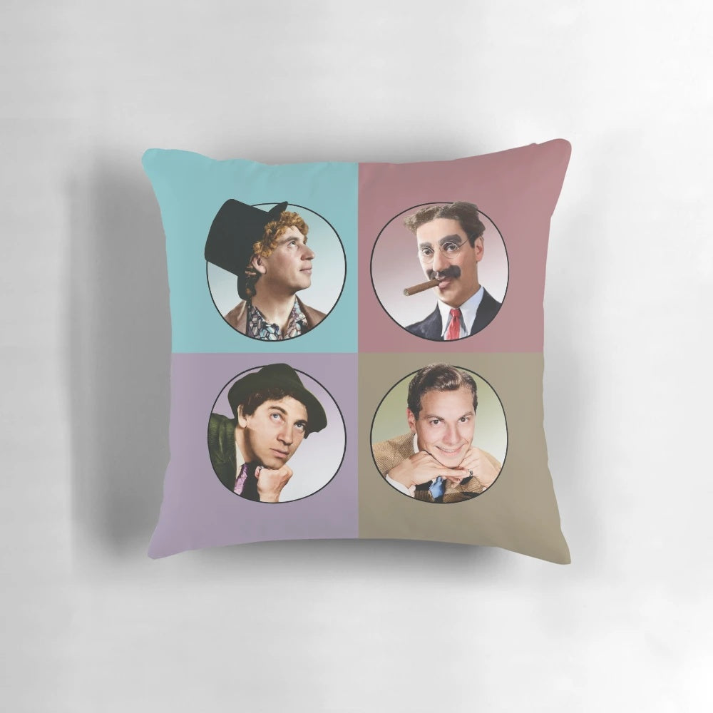 Four colorful illustrations of the iconic Marx Brothers comedians on a decorative pillow.