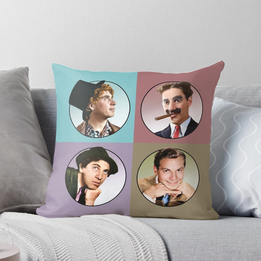 Four colorful illustrations of the iconic Marx Brothers comedians on a decorative pillow.