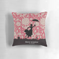 A decorative pillow featuring the silhouette of the iconic character Mary Poppins against a London skyline and floral pattern.