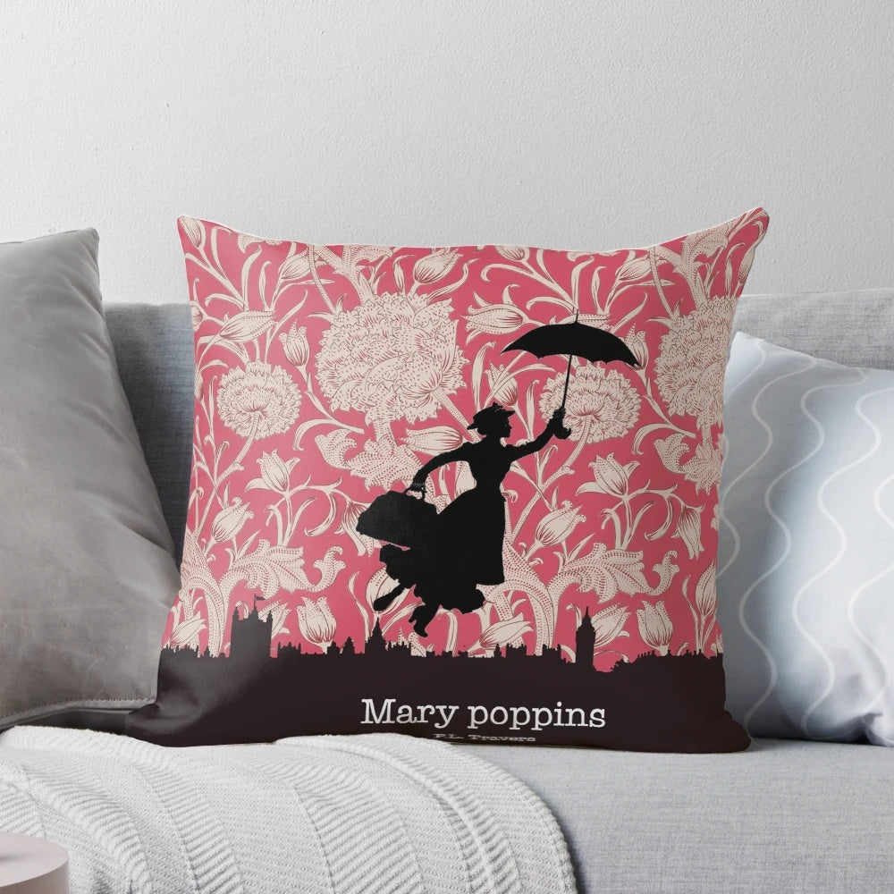 A decorative pillow featuring the silhouette of the iconic character Mary Poppins against a London skyline and floral pattern.