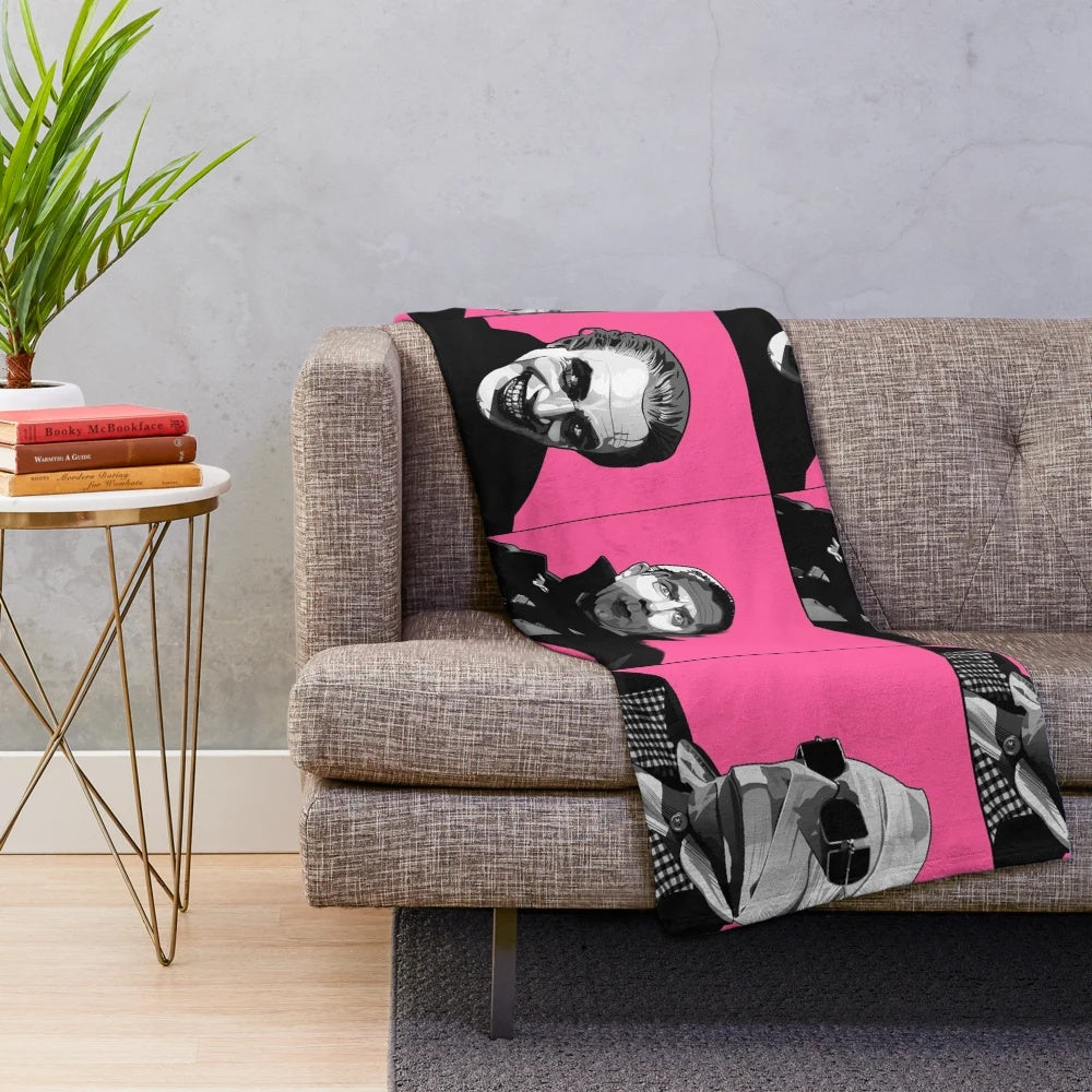 Plush blanket featuring classic movie monsters like Dracula and the Invisible Man in a retro black and white pop art style