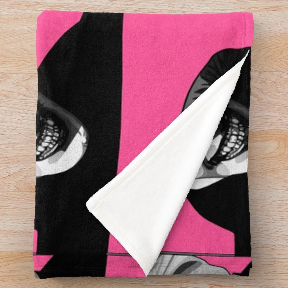 Plush blanket featuring classic movie monsters like Dracula and the Invisible Man in a retro black and white pop art style