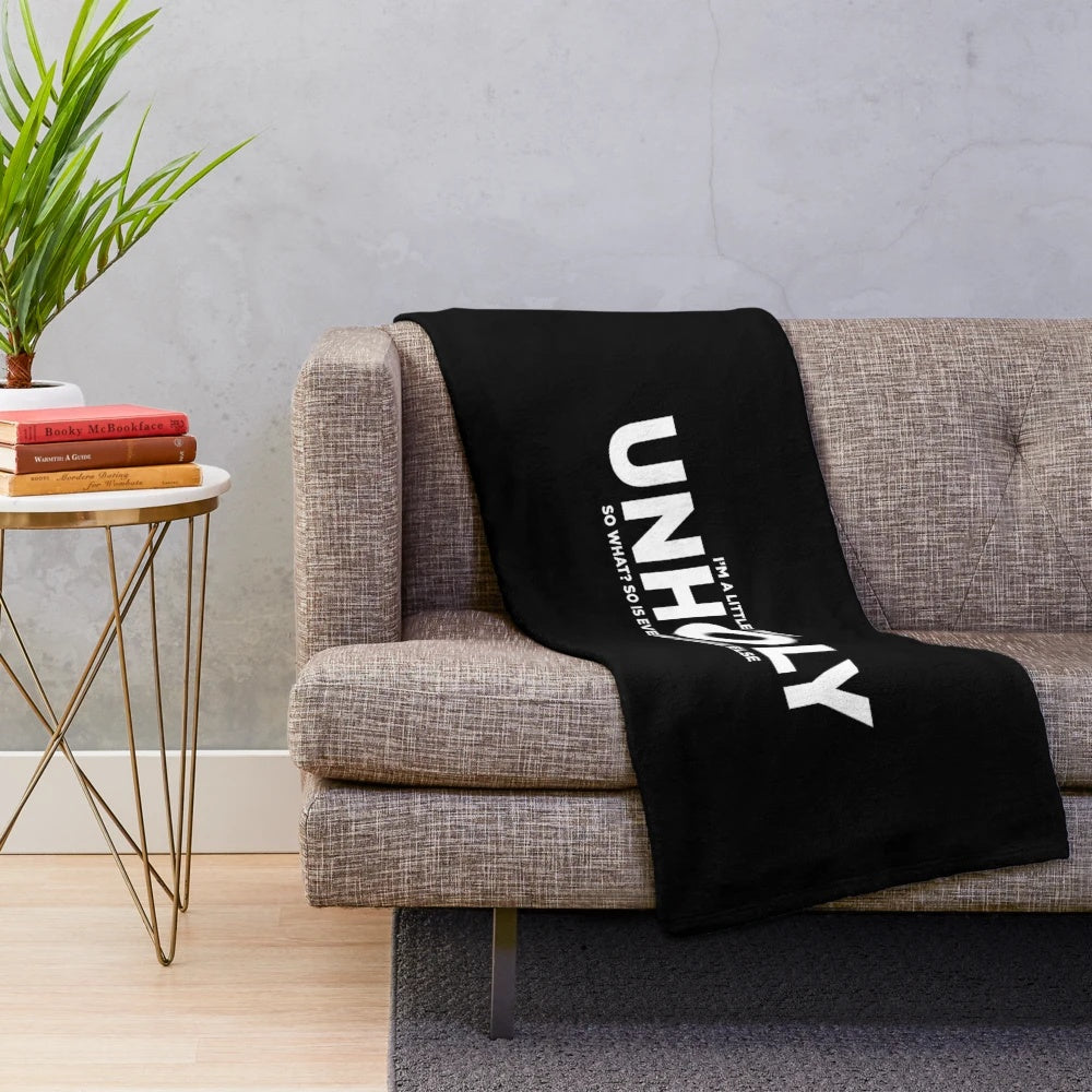 Plush blanket with iconic black and white typography design featuring Queen lyrics