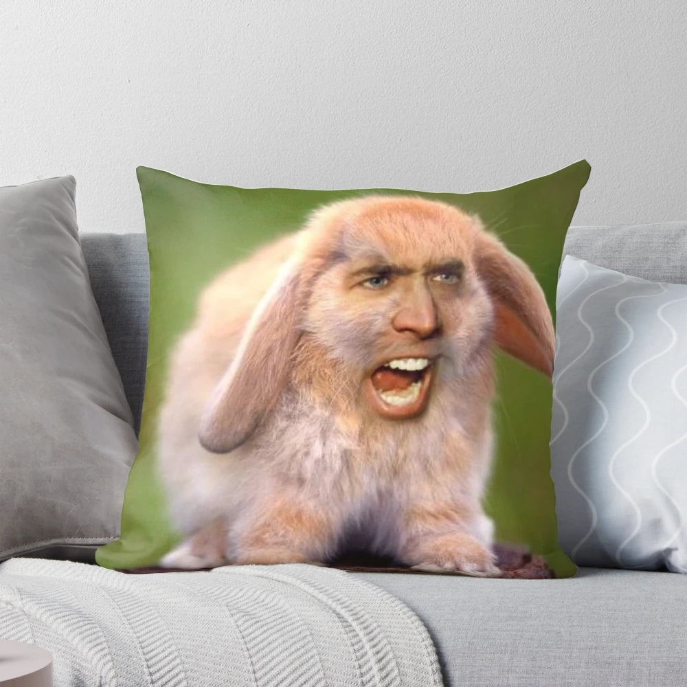 A photoshopped image of a rabbit's face on Nicholas Cage's head, printed on a soft, plush pillow.