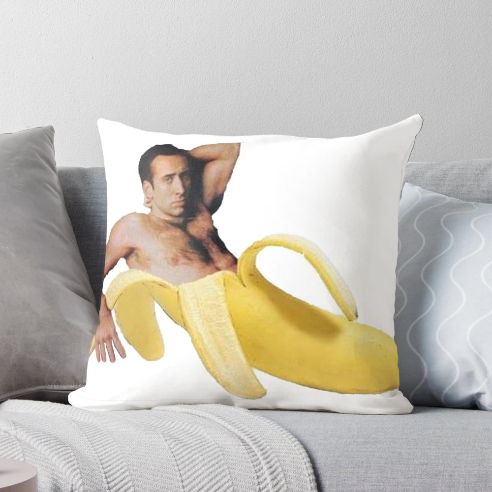Vibrant yellow pillow depicting the iconic "Nicolas Cage in a Banana" meme image
