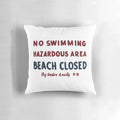 Plush Jaws movie-inspired "No Swimming" sign pillow with vintage shark graphics