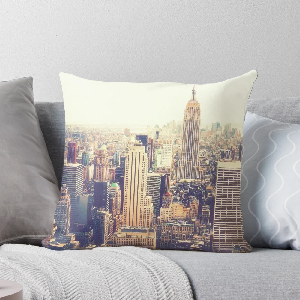A plush, high-quality pillow featuring the iconic skyline of New York City, including the Empire State Building.