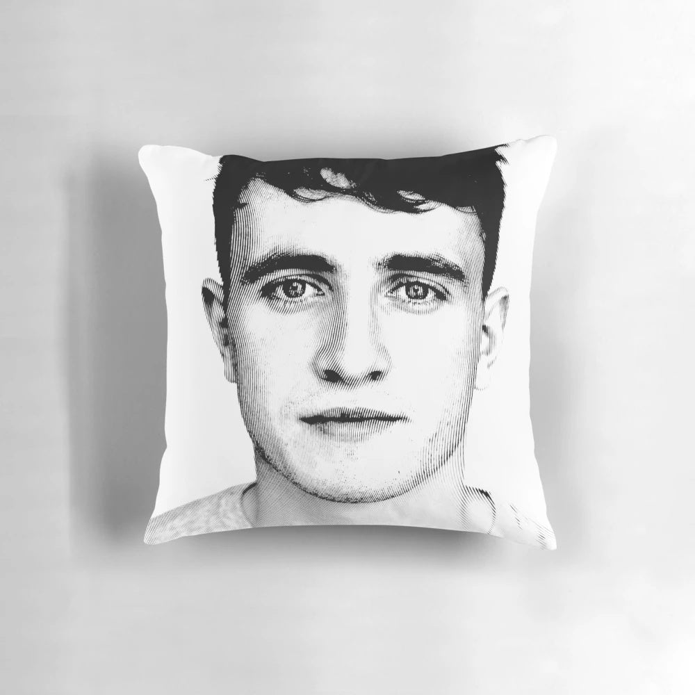 A black and white linocut portrait of actor Paul Mescal printed on a decorative pillow.