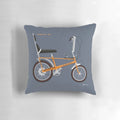 Vibrant orange Raleigh Chopper MK1 pillow with retro 70s design