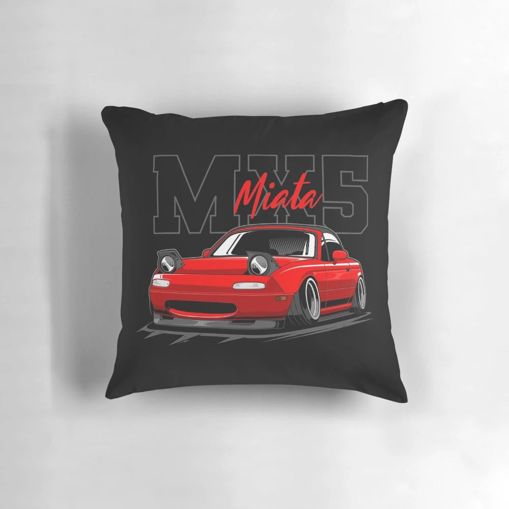 A vibrant red Mazda Miata JDM sports car pillow with a vaporwave, synthwave, and retrowave-inspired design.