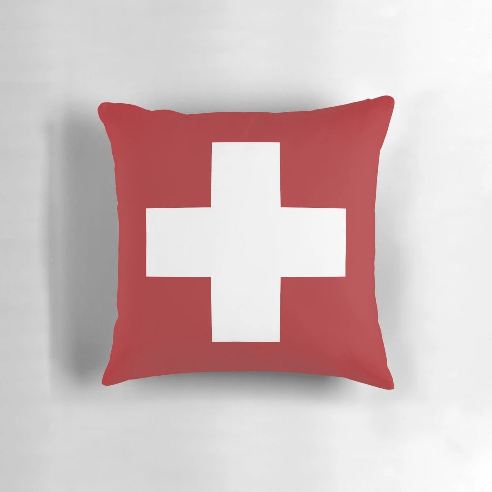 Minimalist Swiss cross red and white pillow, a timeless Scandinavian design icon