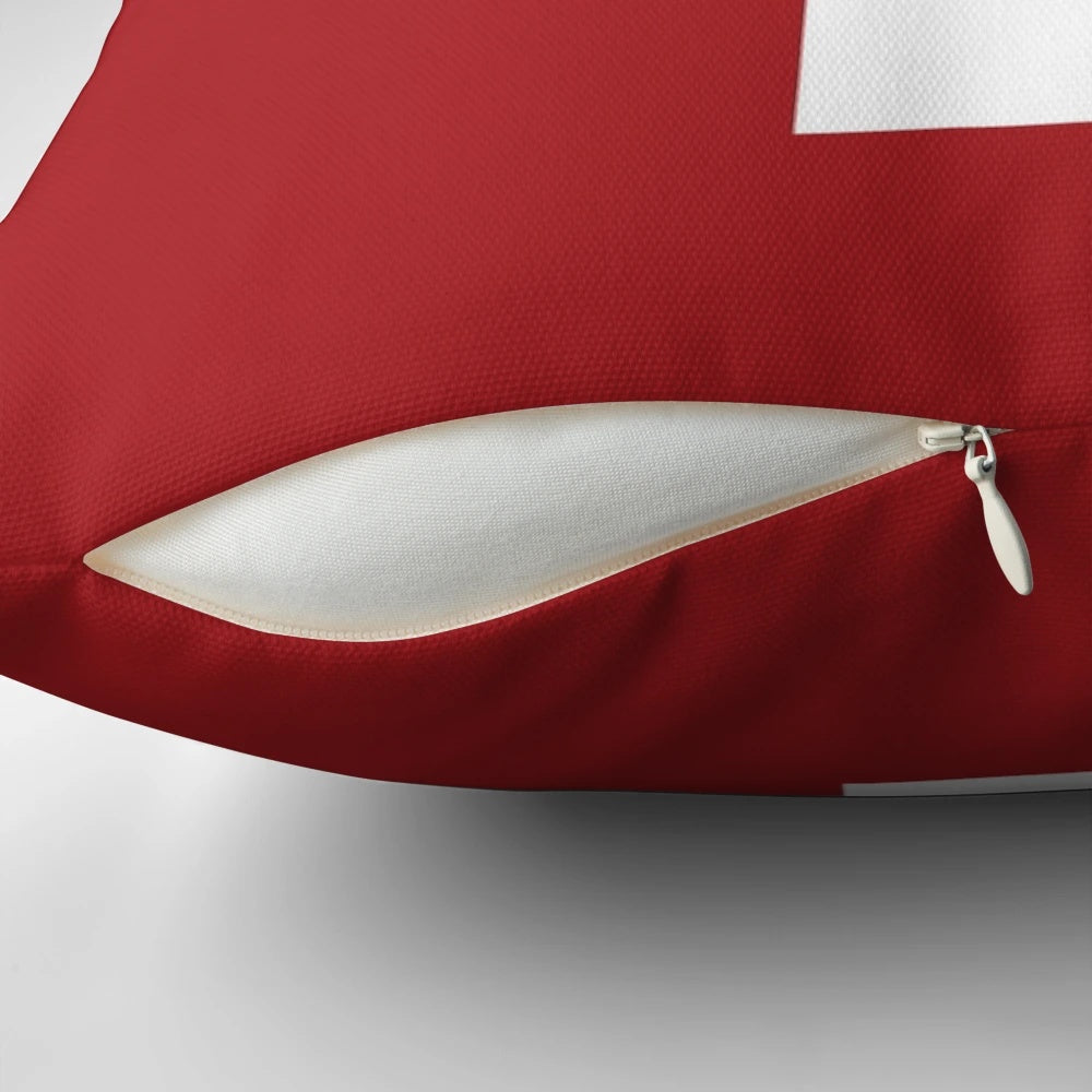 Minimalist Swiss cross red and white pillow, a timeless Scandinavian design icon