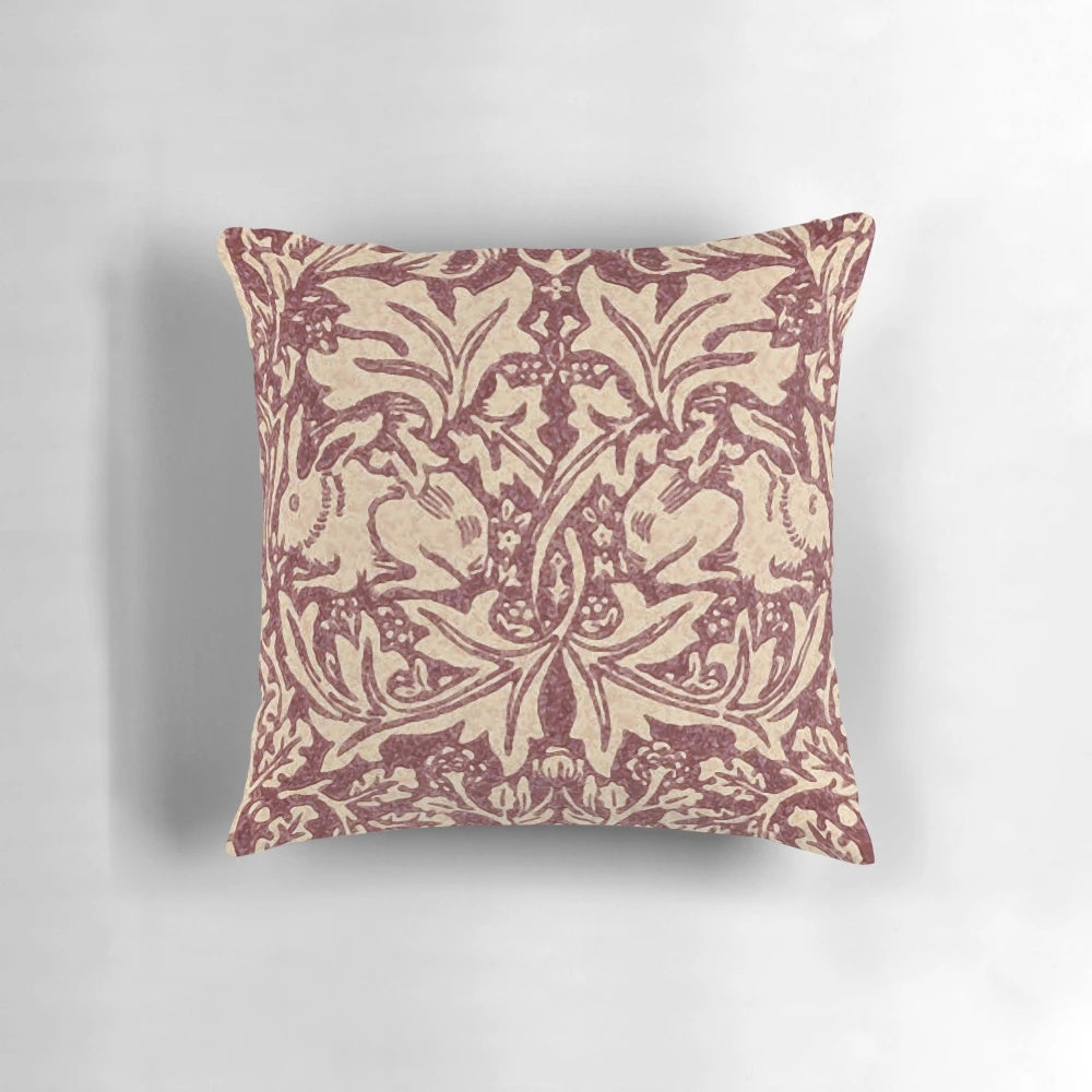 Burgundy patterned pillow with William Morris' iconic Brer Rabbit design