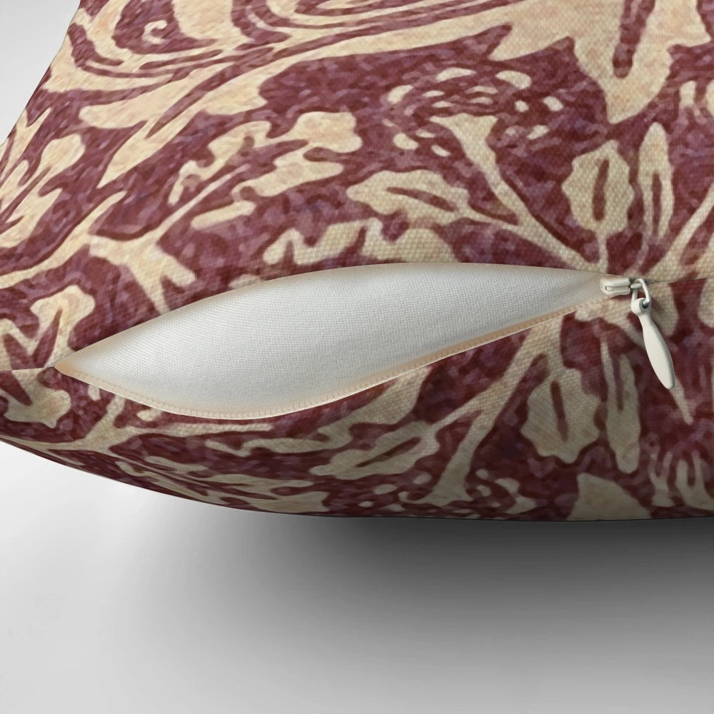 Burgundy patterned pillow with William Morris' iconic Brer Rabbit design