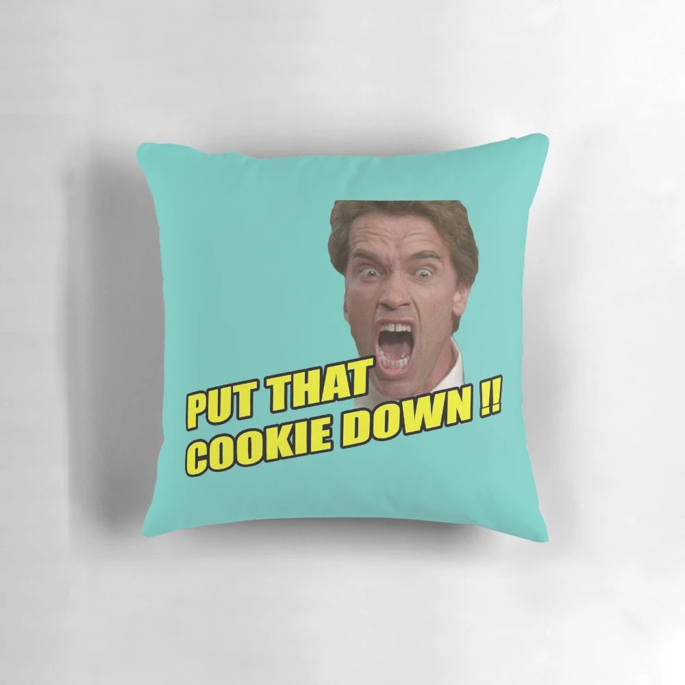 Arnold Schwarzenegger as the Terminator with the quote "I'll Be Back" on a decorative pillow