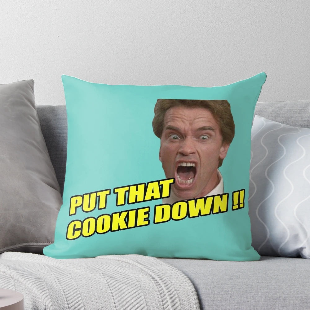Arnold Schwarzenegger as the Terminator with the quote "I'll Be Back" on a decorative pillow
