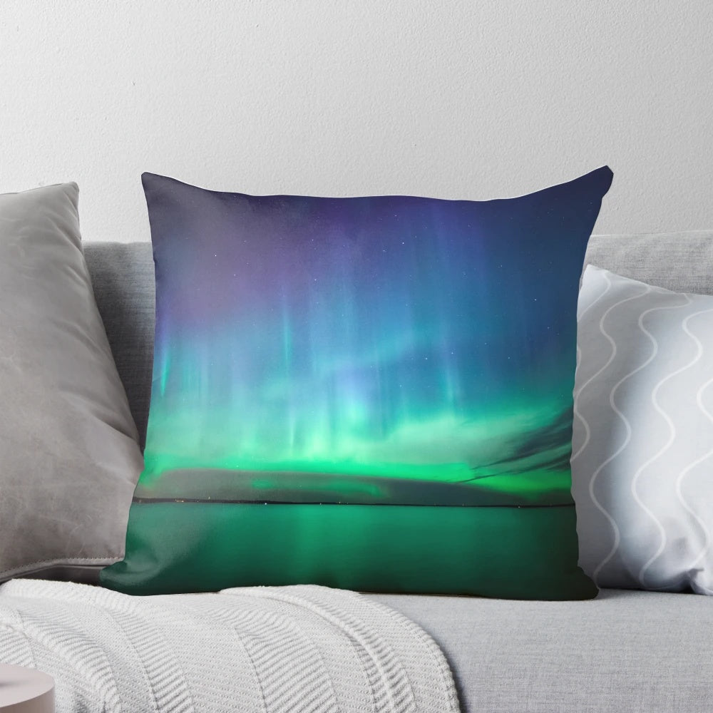 Stunning pillow featuring the captivating northern lights (aurora borealis) in a night sky landscape.