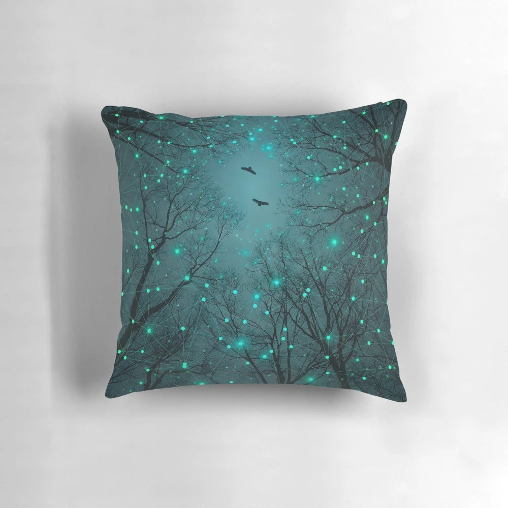 Pillow featuring a design of glowing geometric stars against a teal and mint galaxy background