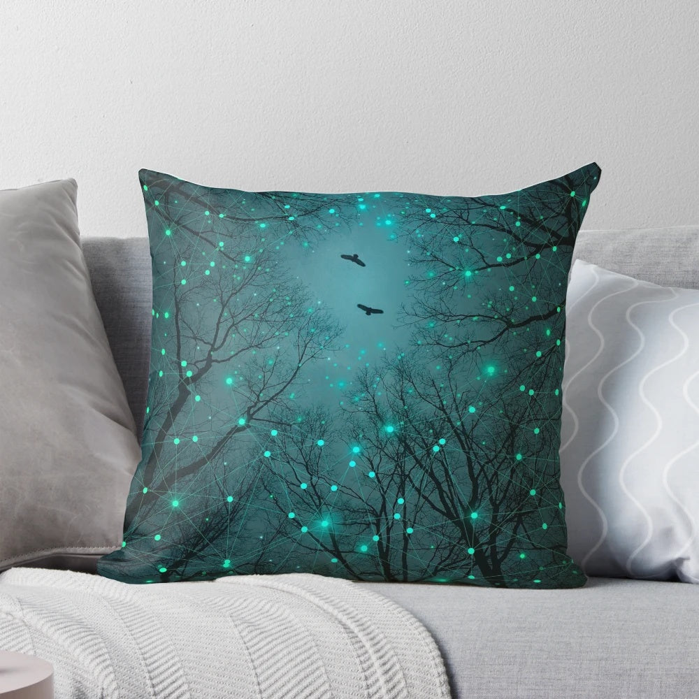 Pillow featuring a design of glowing geometric stars against a teal and mint galaxy background