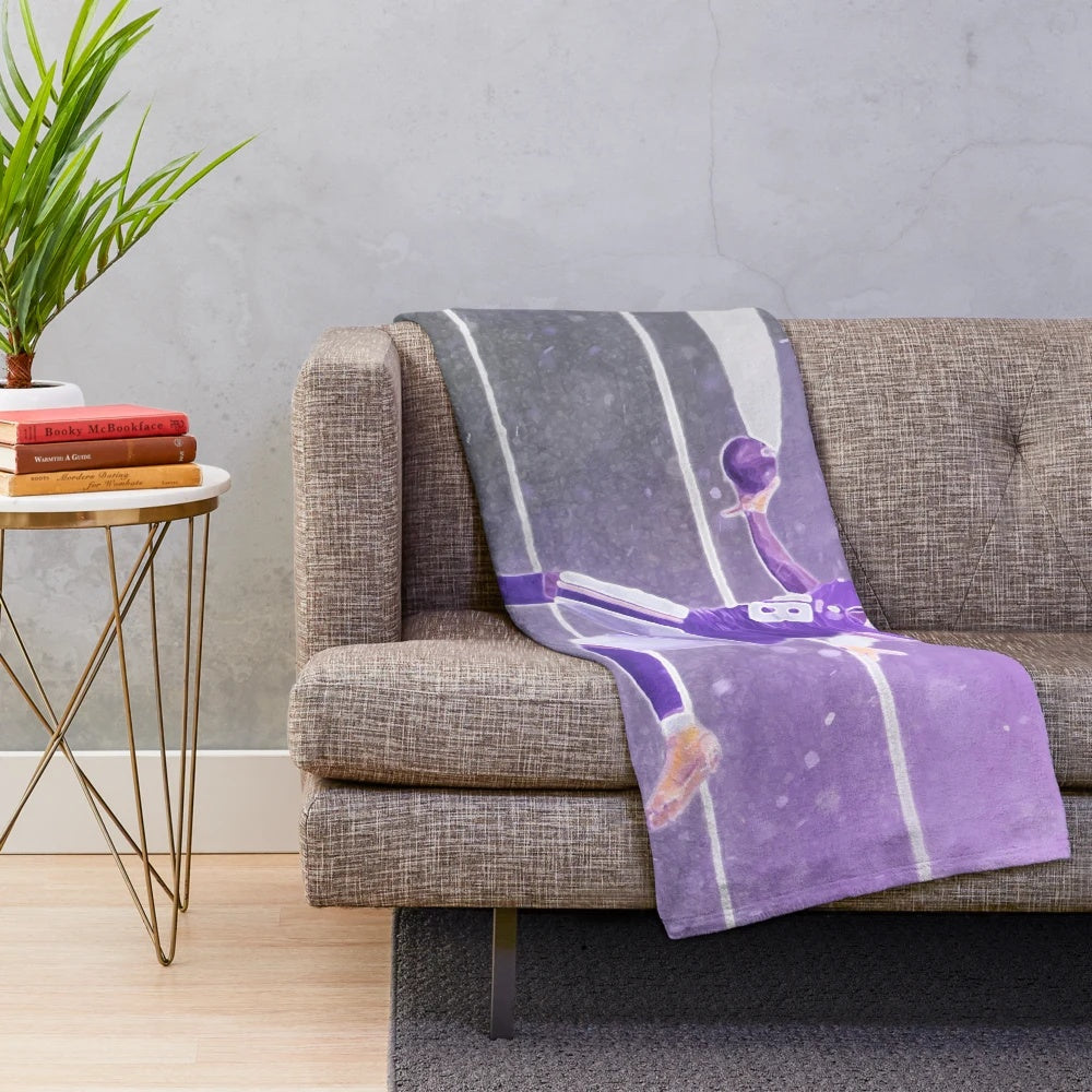 Illustration of Justin Jefferson in a purple and yellow plush blanket