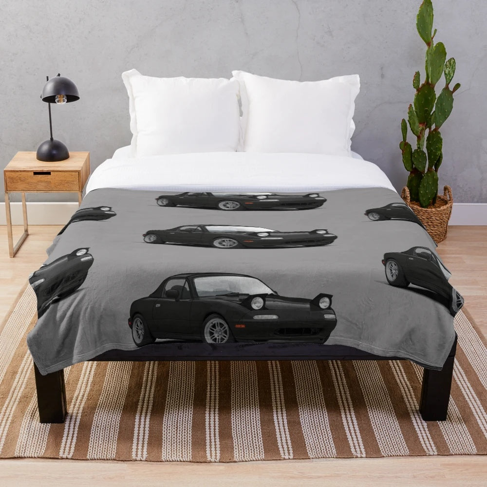 Illustration of a Mazda MX-5 Miata NA MK1 on a plush blanket
