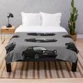 Illustration of a Mazda MX-5 Miata NA MK1 on a plush blanket