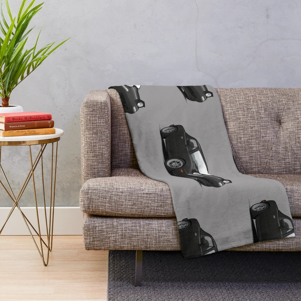Illustration of a Mazda MX-5 Miata NA MK1 on a plush blanket