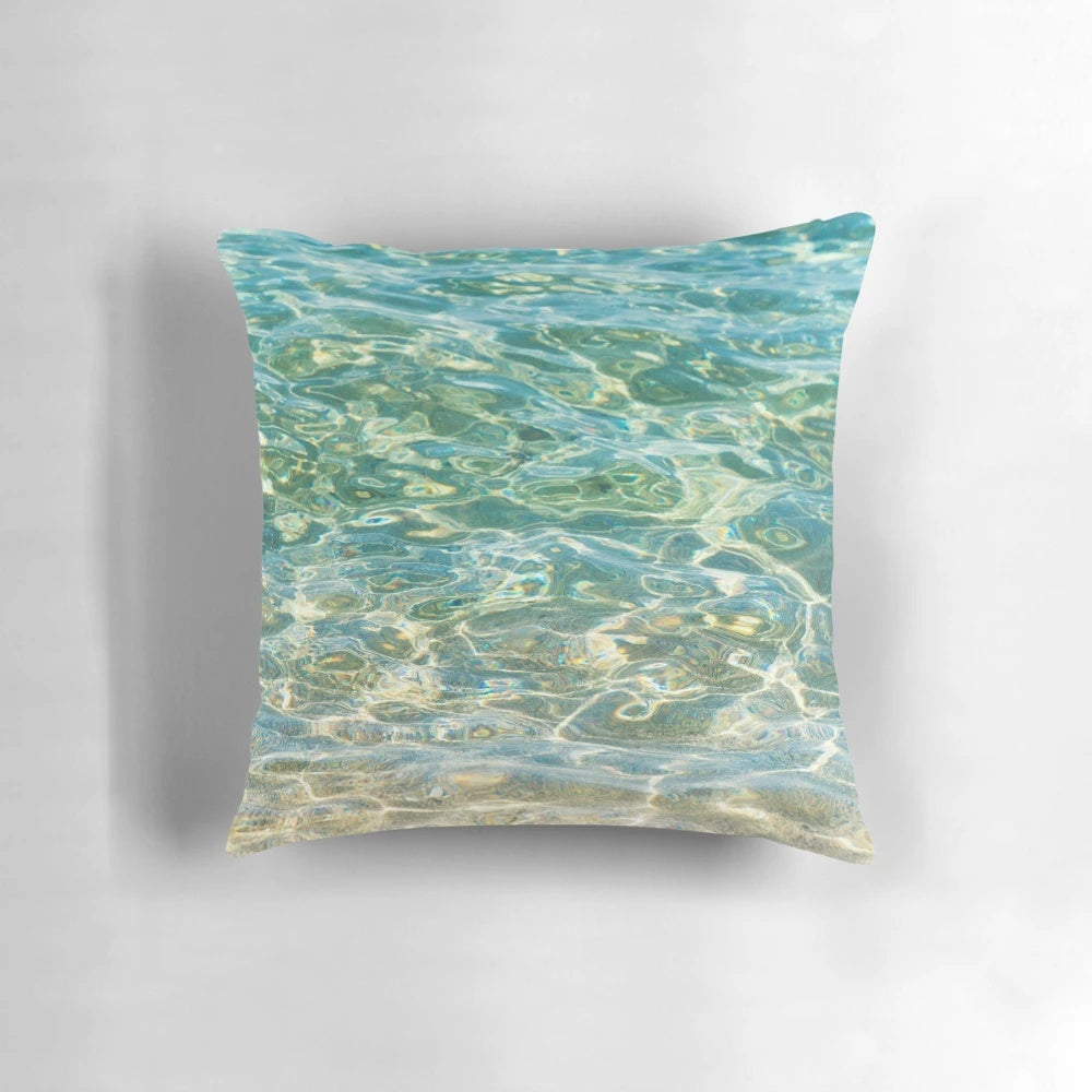 A soothing and serene pillow that captures the essence of crystal clear aqua blue ocean water.
