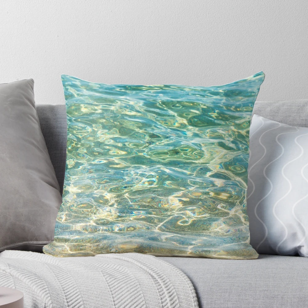 A soothing and serene pillow that captures the essence of crystal clear aqua blue ocean water.