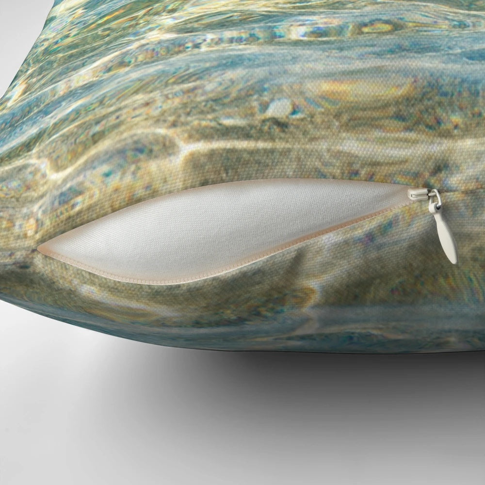 A soothing and serene pillow that captures the essence of crystal clear aqua blue ocean water.