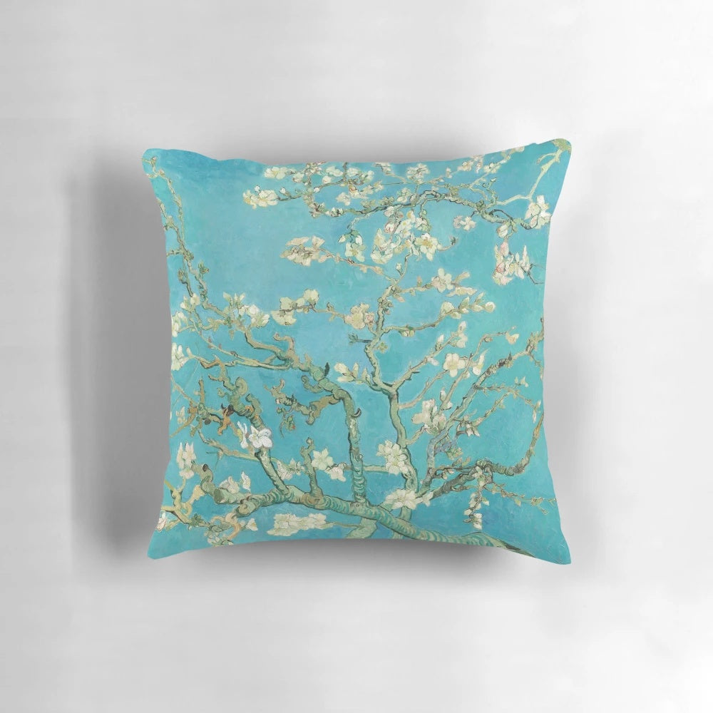 Decorative throw pillow featuring the impressionist painting "Almond Blossoms" by Vincent Van Gogh
