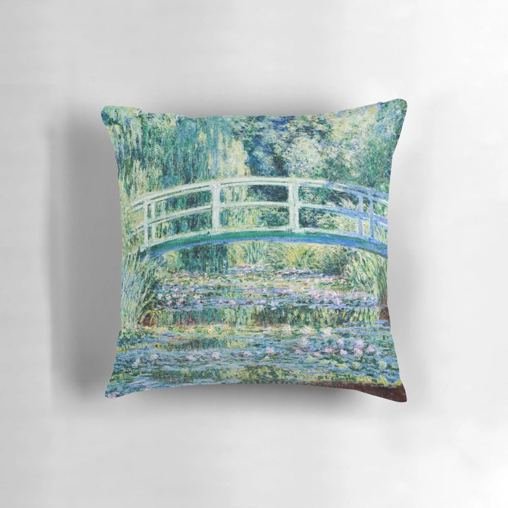 Monet's Water Lilies and Japanese Bridge oil painting reproduced on a decorative throw pillow.