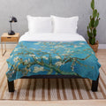 Plush blanket featuring a vintage-style print of Van Gogh's Almond Blossom painting