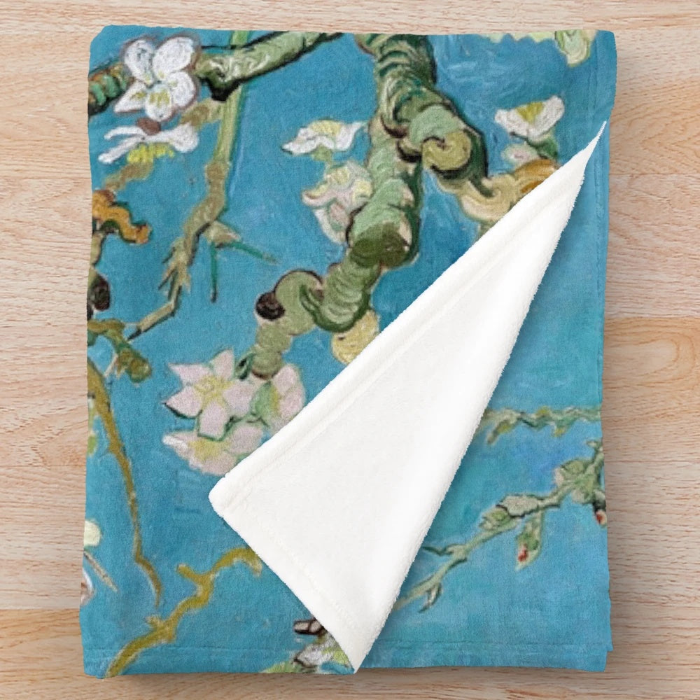 Plush blanket featuring a vintage-style print of Van Gogh's Almond Blossom painting