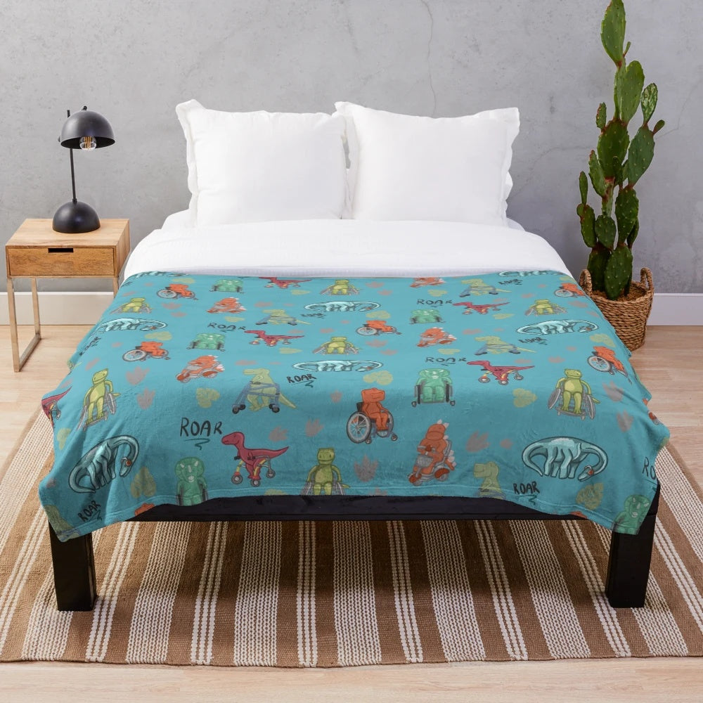 Inclusive dinosaur plush blanket featuring dinosaurs with mobility devices