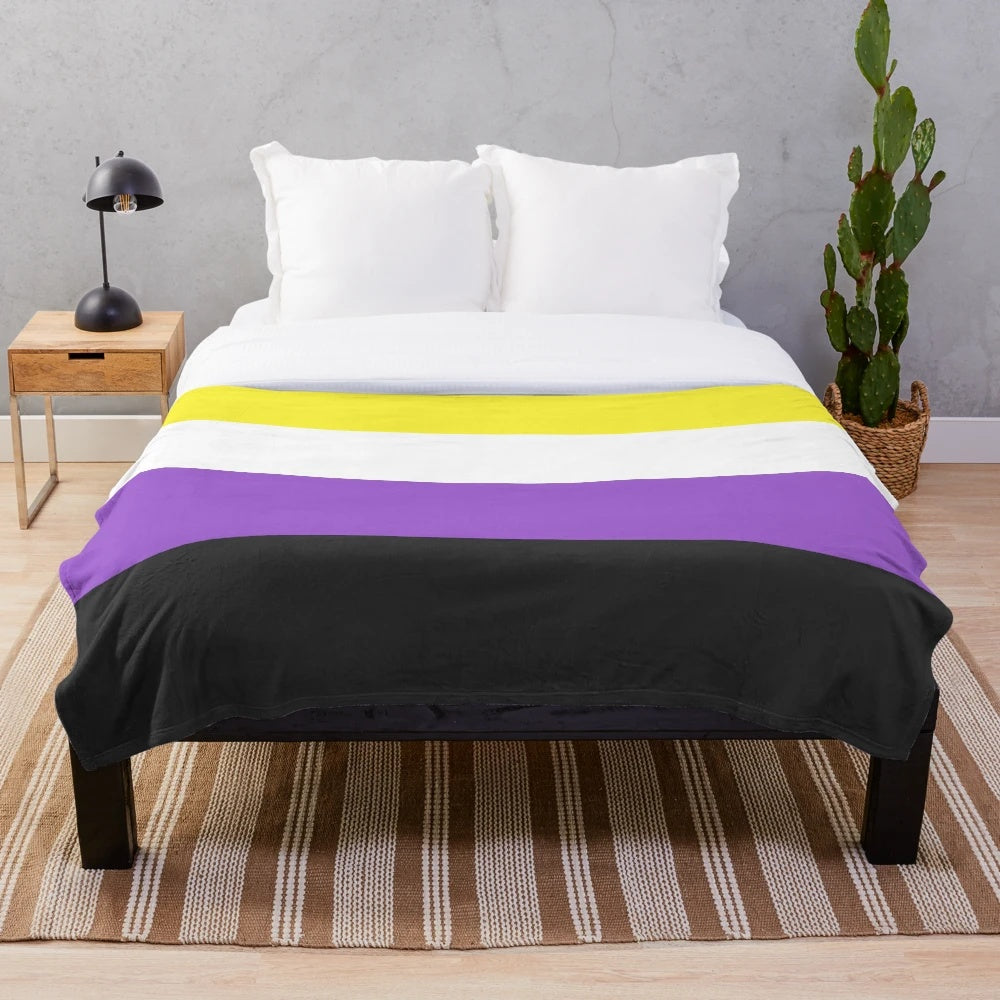 Plush blanket with a seamless repeating non-binary pride flag pattern design
