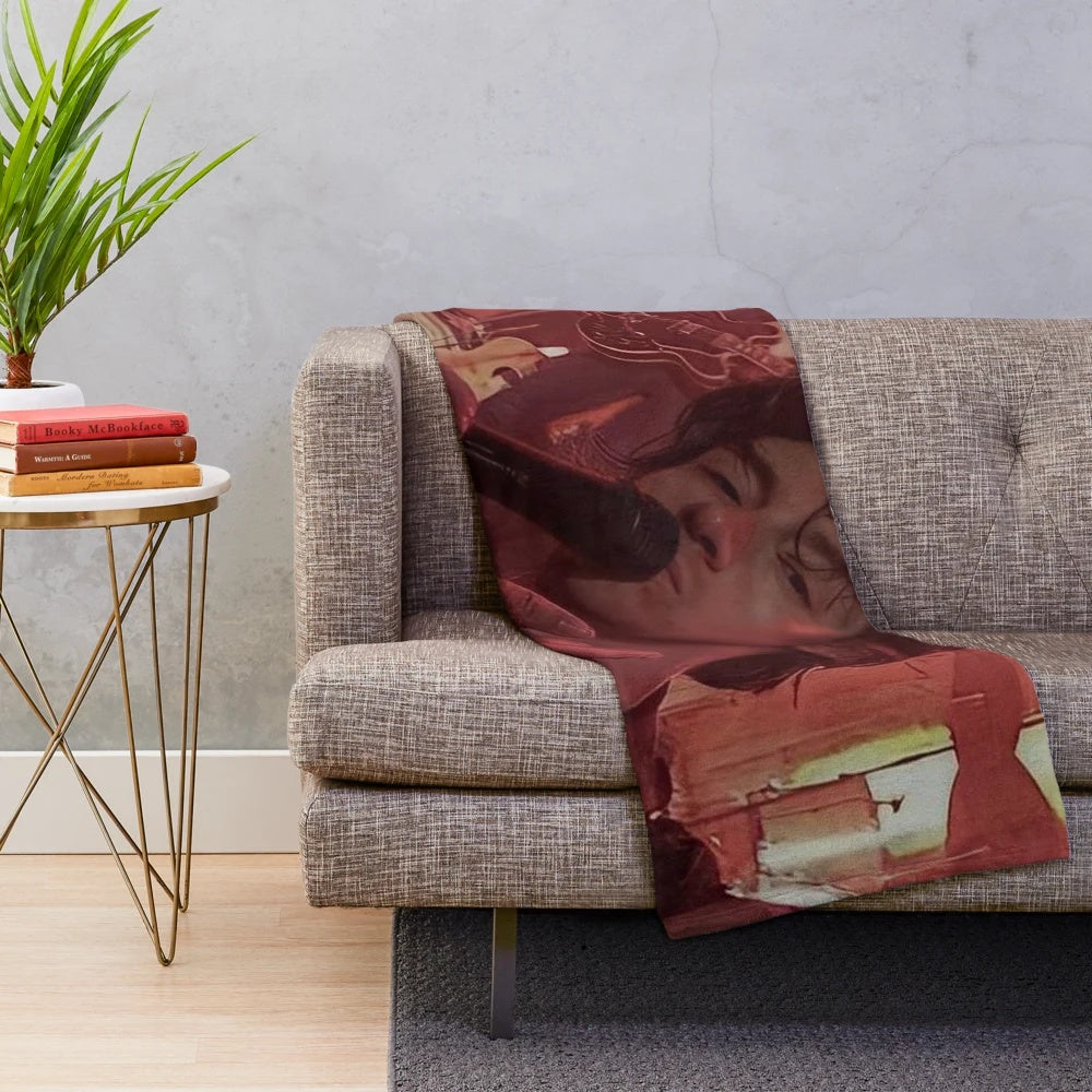 Cozy plush blanket featuring an artistic design inspired by indie rock band Arctic Monkeys and frontman Alex Turner