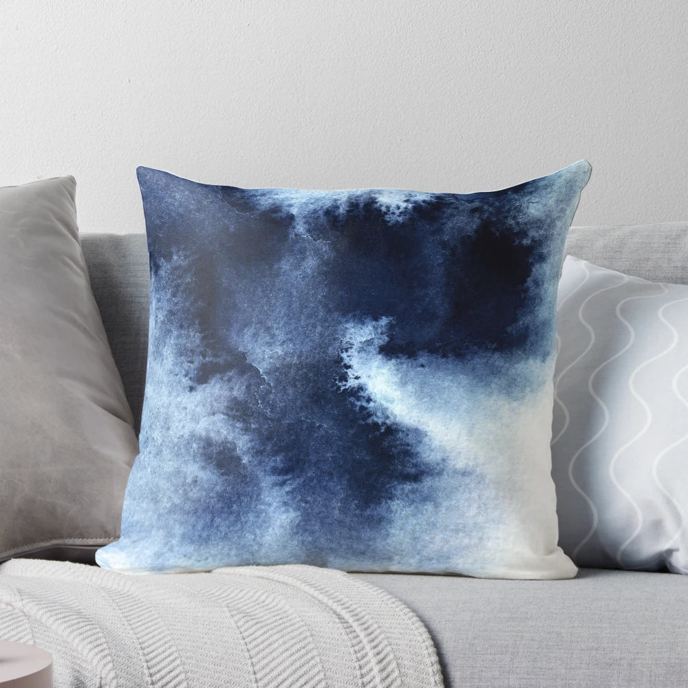 Indigo blue abstract painting pillow with a dreamy, cloud-like watercolor design