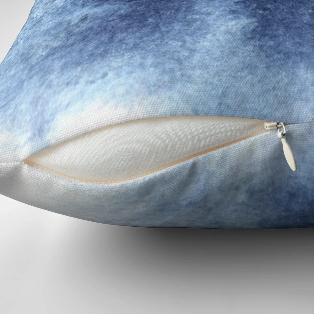 Indigo blue abstract painting pillow with a dreamy, cloud-like watercolor design