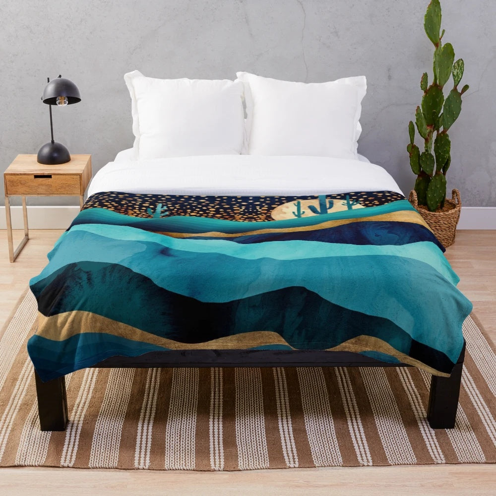 Indigo and navy blue plush blanket with desert night landscape design