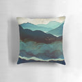 Indigo Mountain Landscape Pillow featuring a contemporary watercolor design of mountains, birds, and a blue and gold color palette.